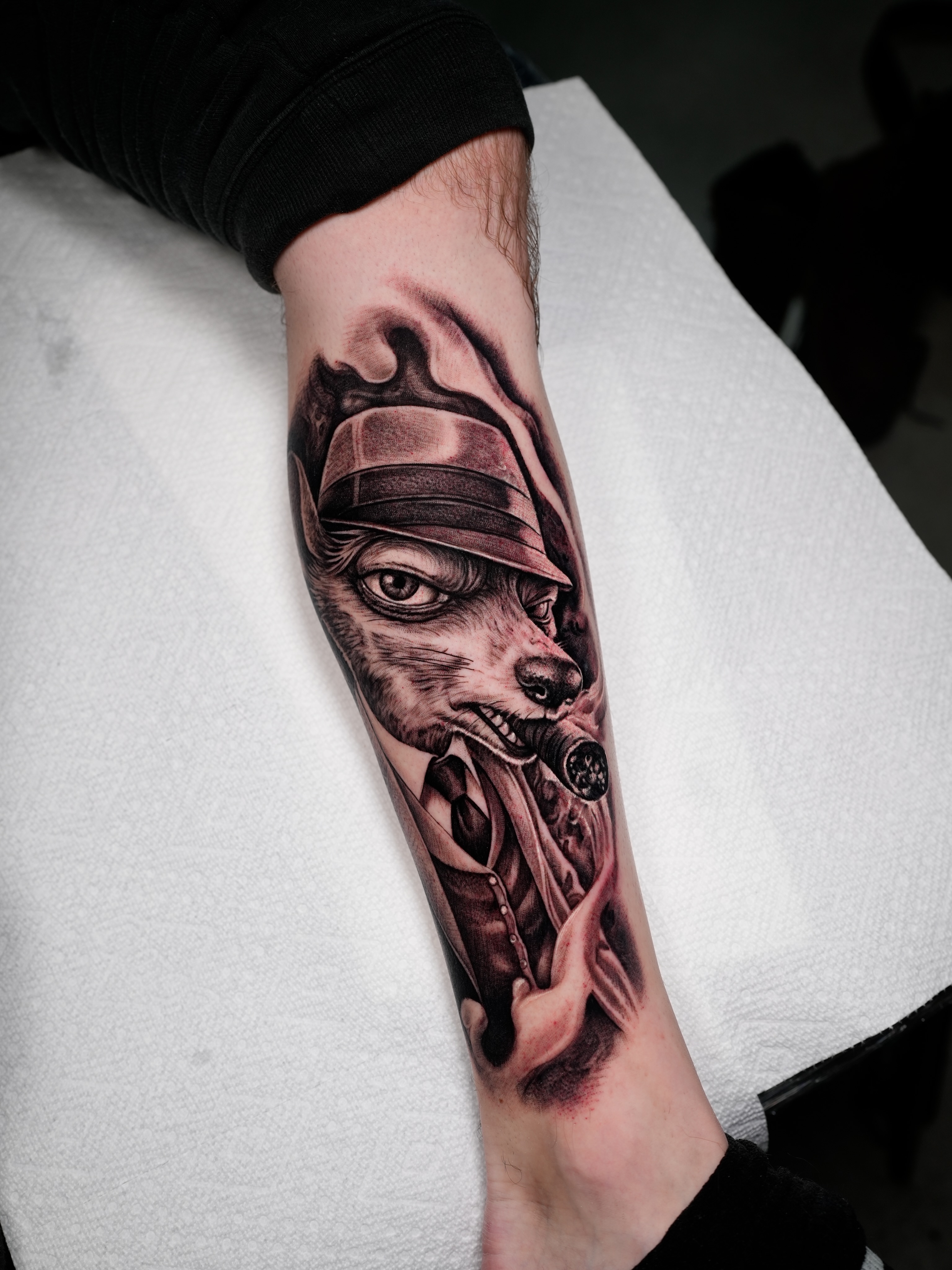 Dog wearing hat realism tattoo on the forearm by Ink Warden  Tattoo