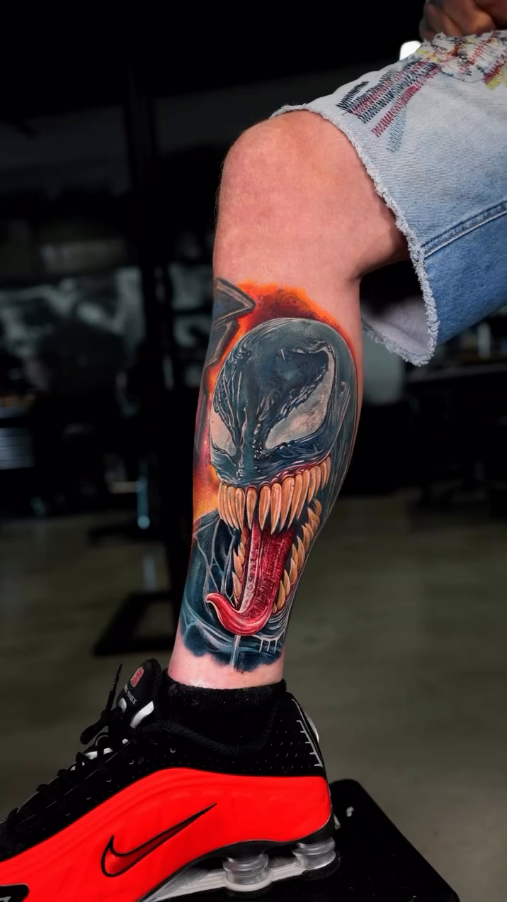Venom portrait on leg realism tattoo on the calf by Ink Warden  Tattoo