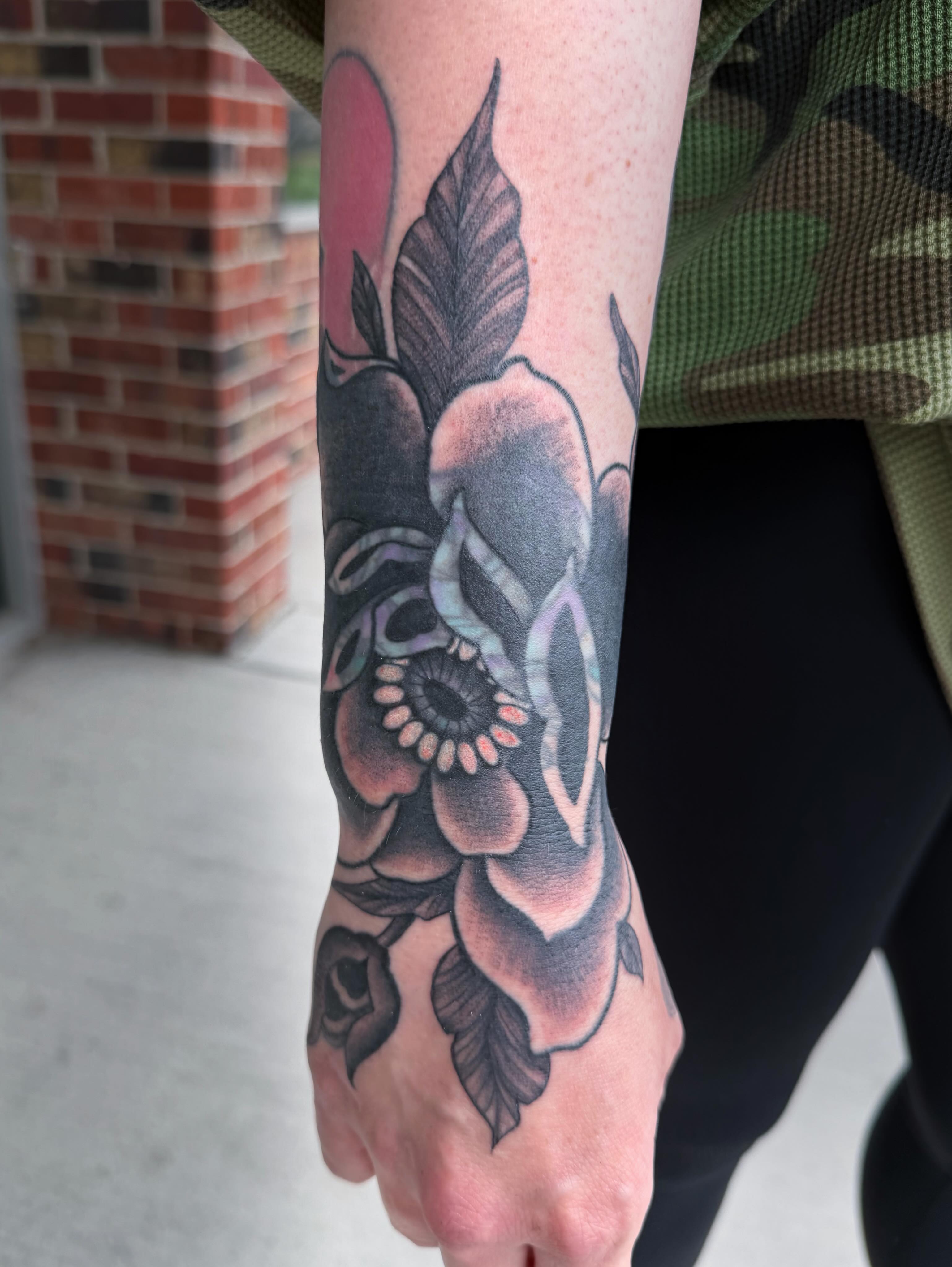 Flower black and grey tattoo on the forearm by rocky love