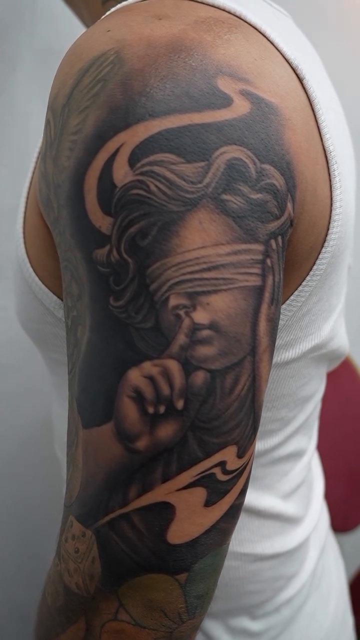Tattoo by @bornrebel_tattoos — realism, black_and_grey