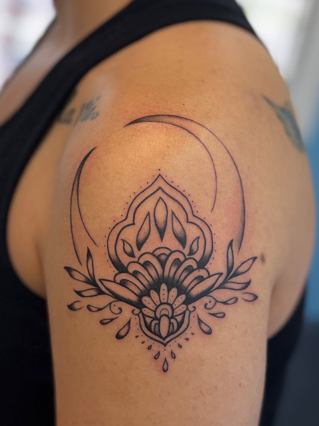 Ornamental lotus with crescent moon ornamental tattoo on the shoulder by Béle Benard