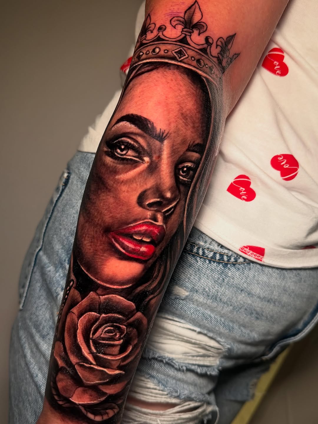 Woman with crown and rose realism tattoo on the forearm by Anghel Patricia