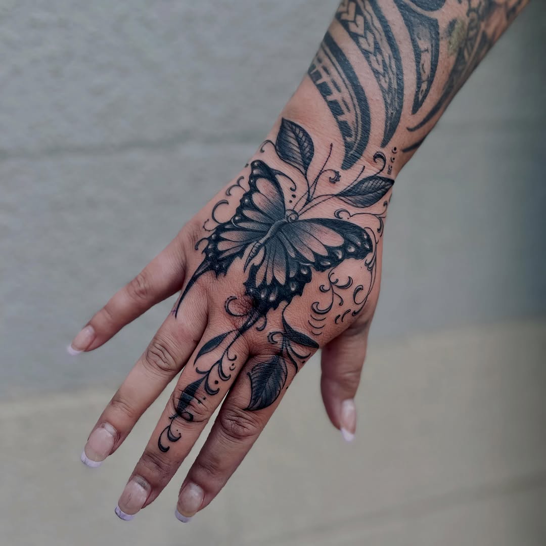 Butterfly and leaves fine line tattoo on the hand by Christien Xavier Alba, Salt Lake City, Utah