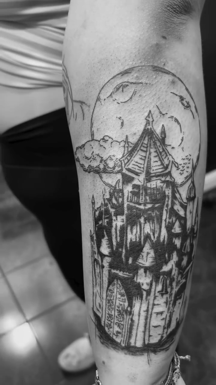 Haunted castle under a full moon dark art tattoo on the forearm by ✨Tattoos By Martina ✨