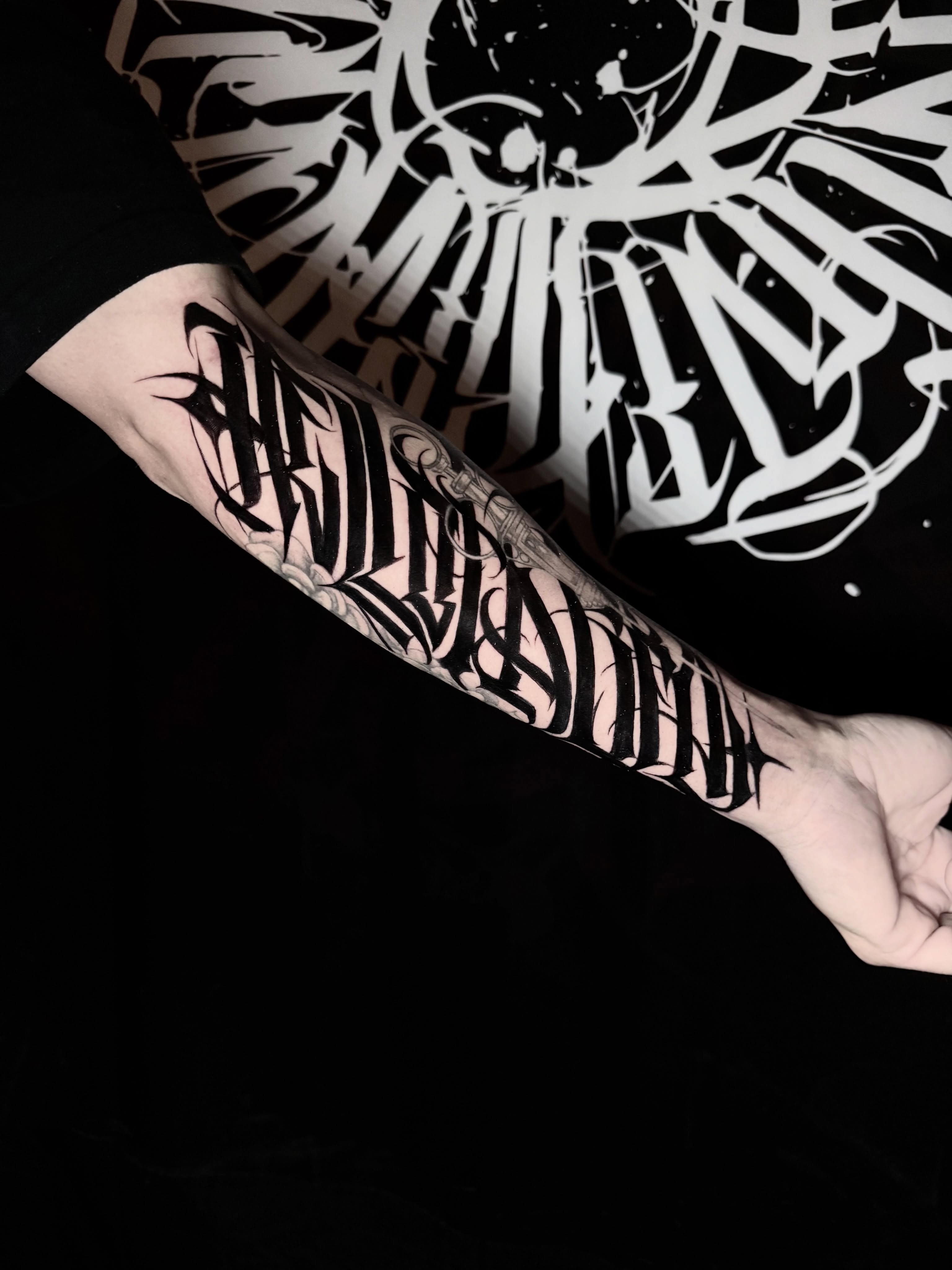 Tattoo by @wiseroner — lettering_script, blackwork