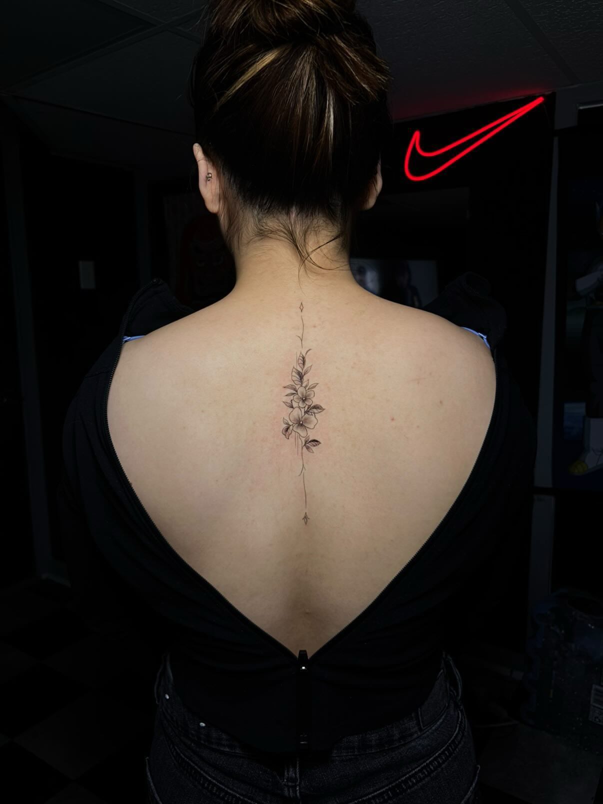 Flower black and grey tattoo on the back by Nikko