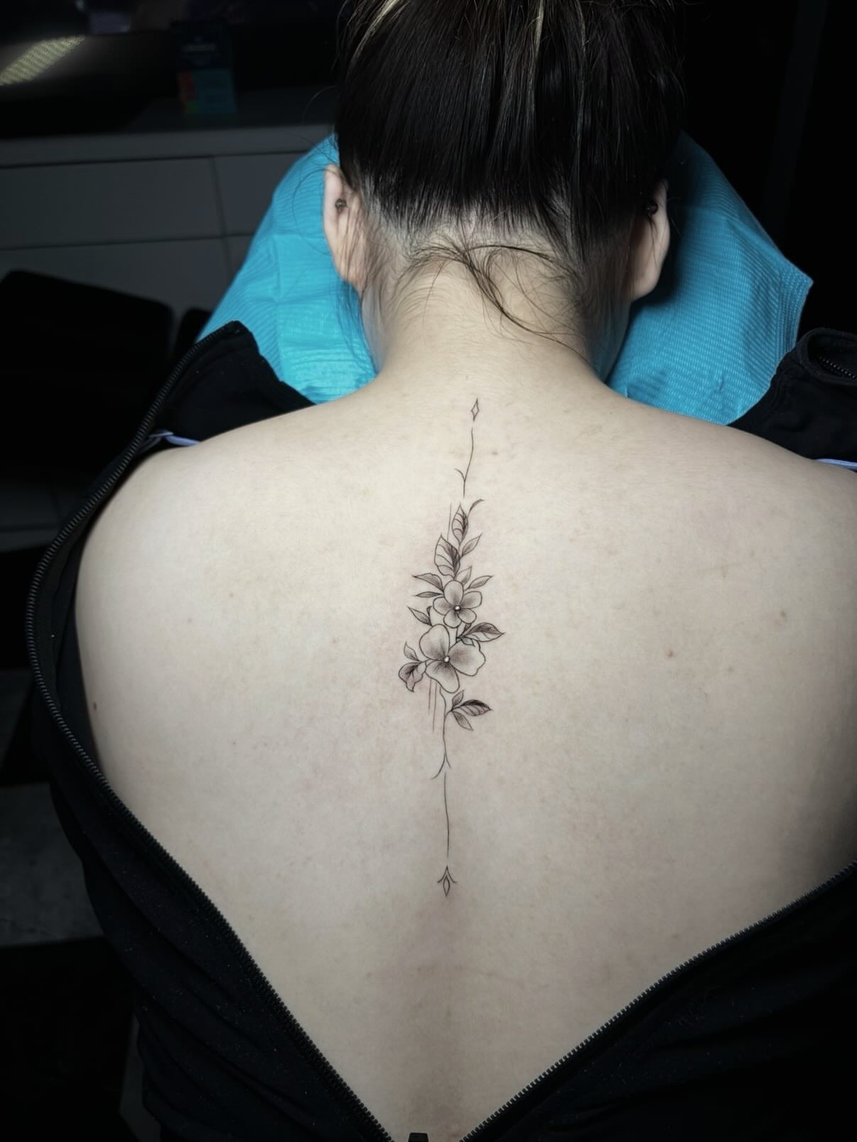 Flower vine black and grey tattoo on the back by Nikko