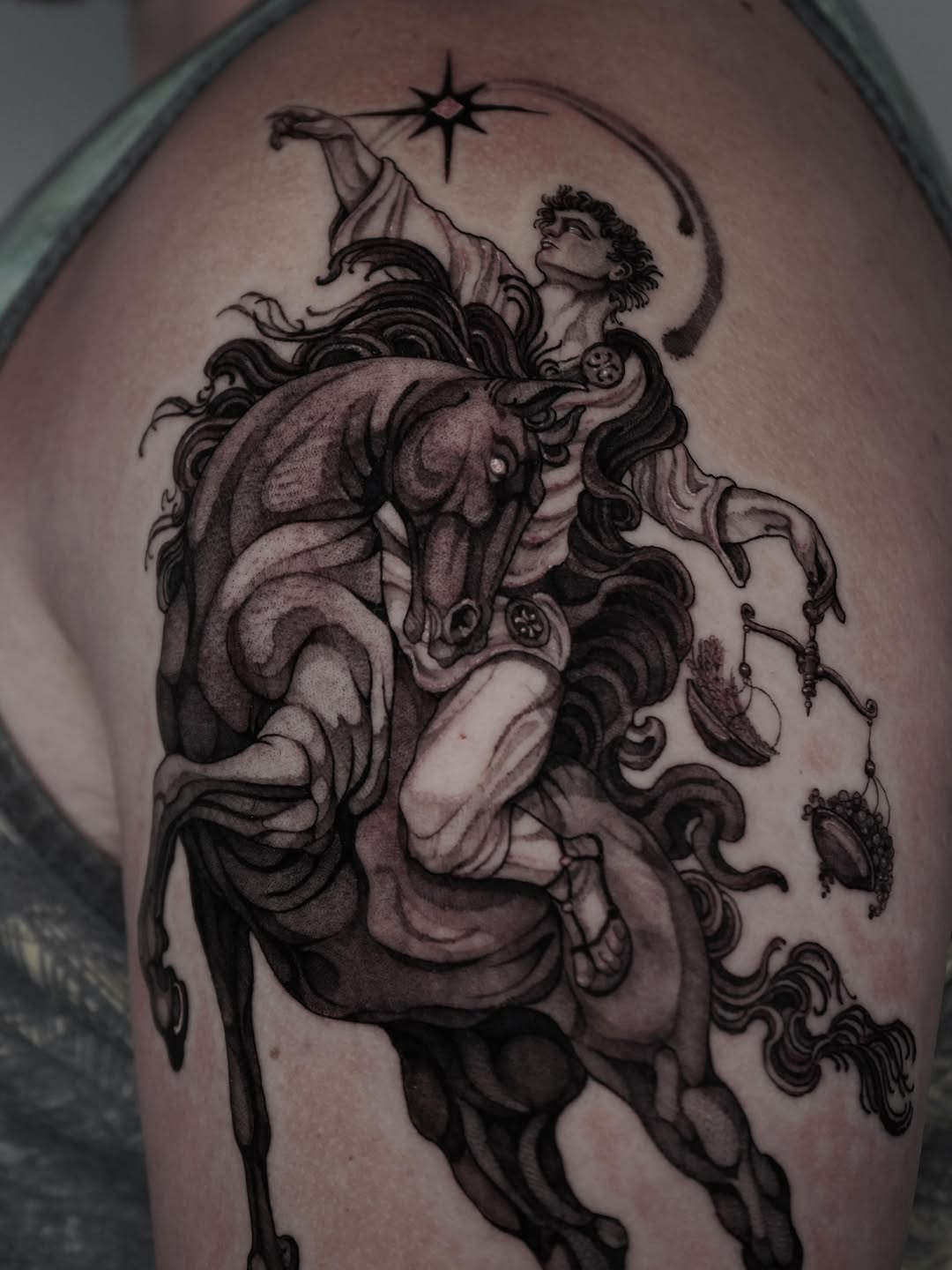 Charioteer with scales realism tattoo on the thigh by Drew Nelson