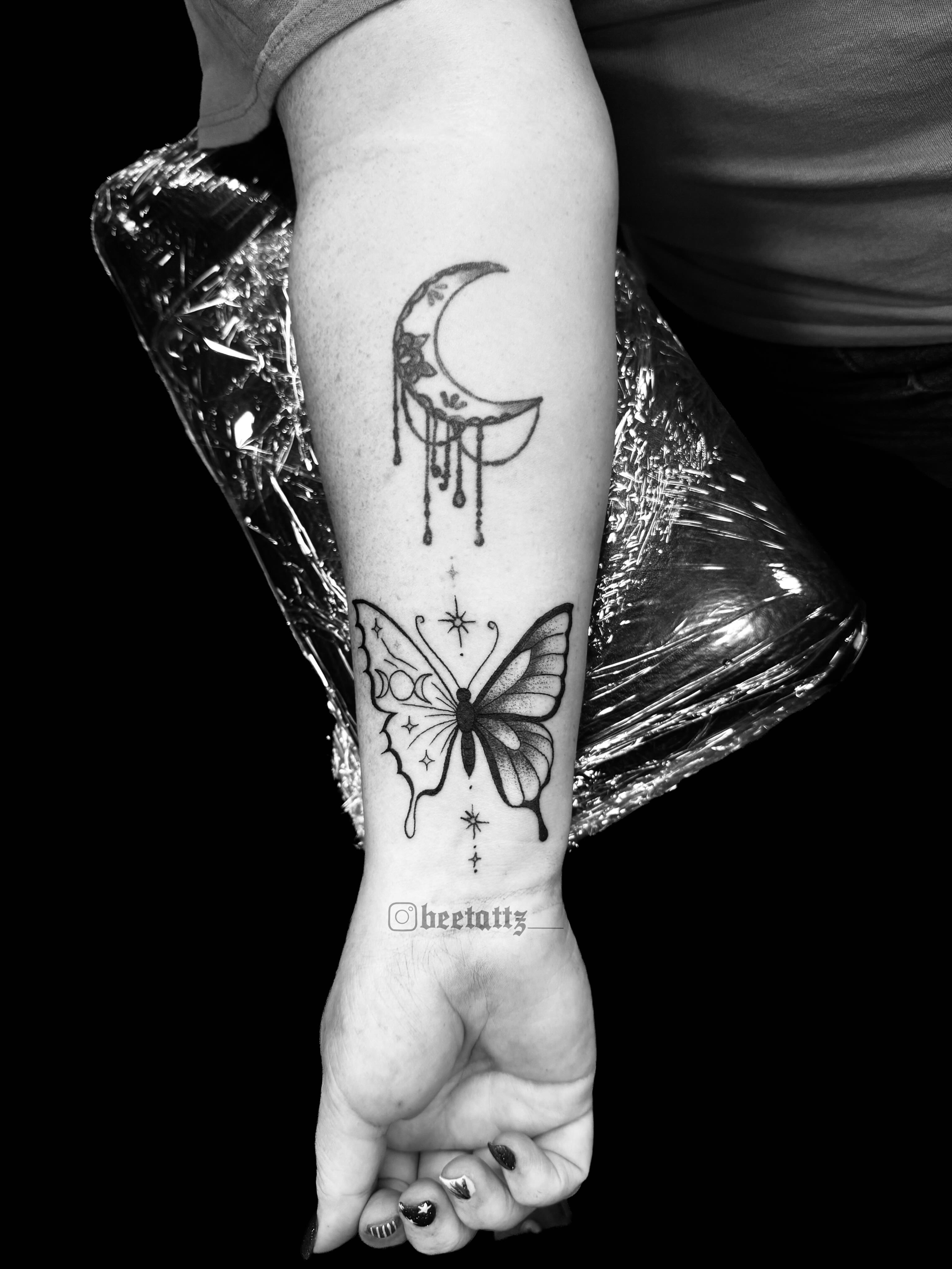 Butterfly and crescent moon black and grey tattoo on the foot by Brinkley McGill