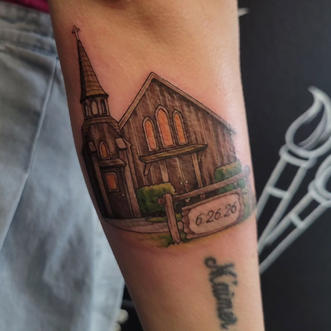 Church with date sign tattoo on the forearm by Marina Cobb