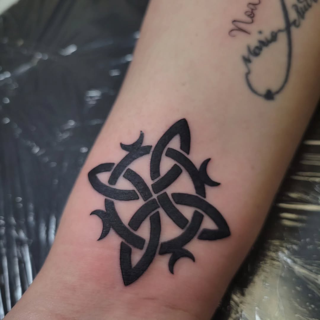 Celtic knot tribal tattoo on the forearm by Marina Cobb