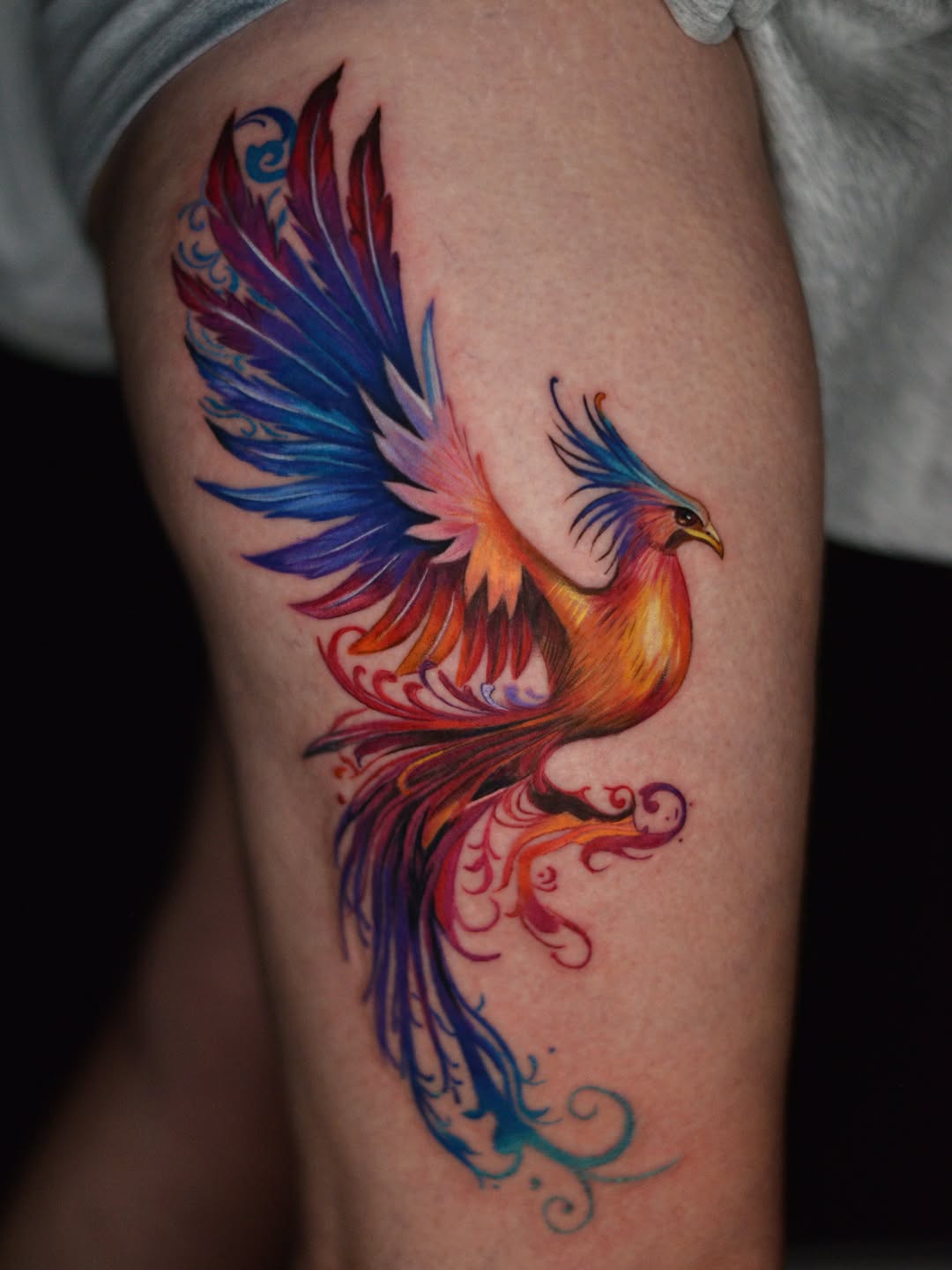 Phoenix bird realism tattoo on the thigh by Jules, Arlington, Texas