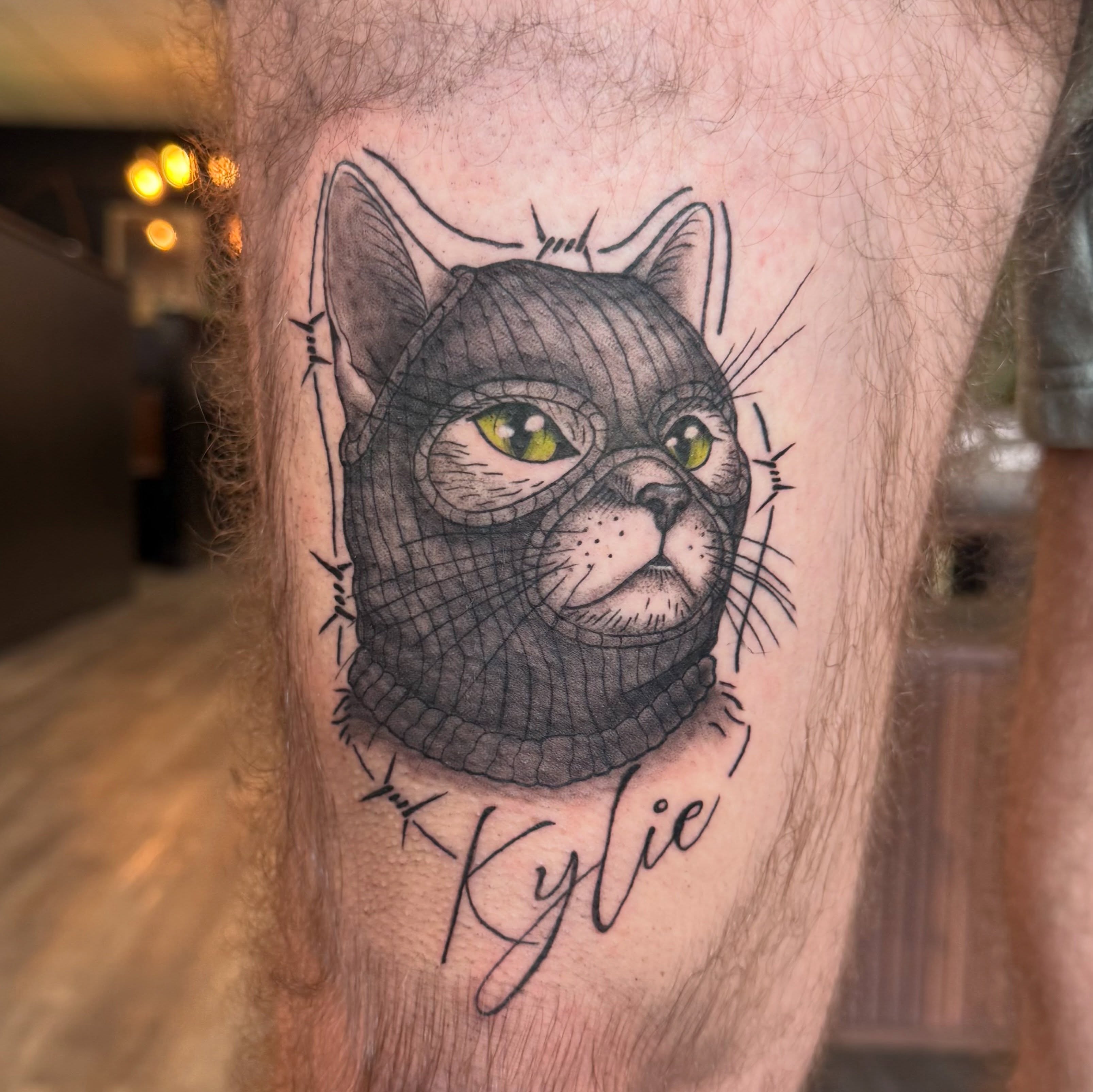 Cat realism tattoo on the thigh by Kate Marie