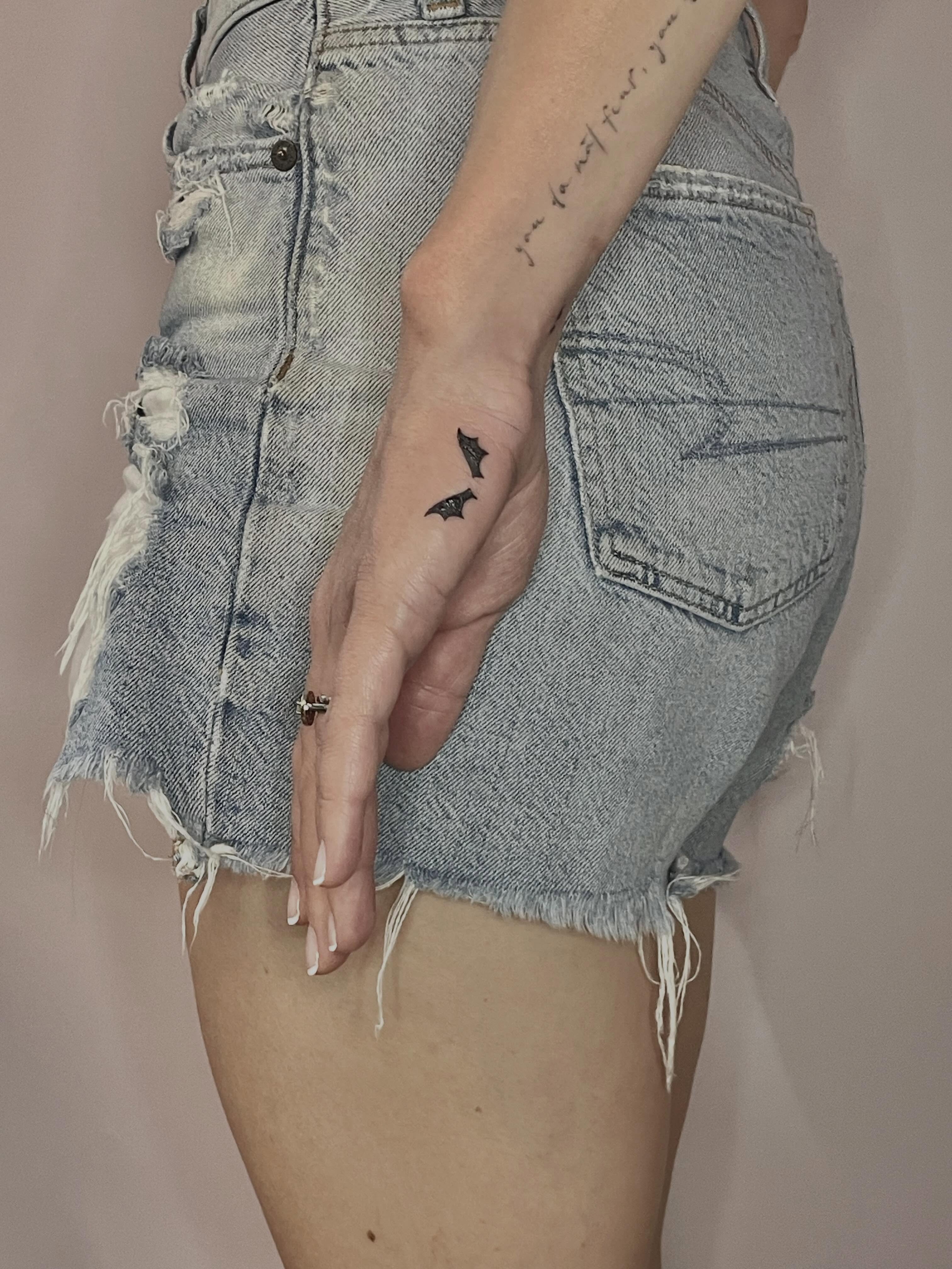 Bat black and grey tattoo on the hand by Sierra Seton