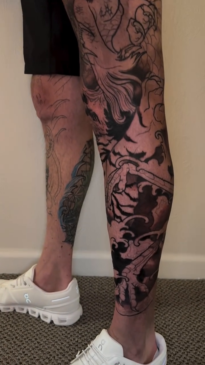 Dragon and tiger leg sleeve Japanese tattoo on the leg by Mike Nance