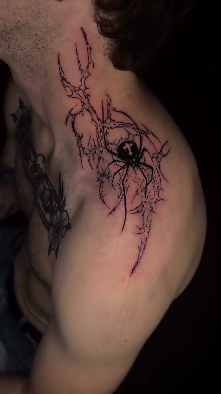 Spider with abstract elements blackwork tattoo on the shoulder by Seattle Cybersigilism Tattoo Horror