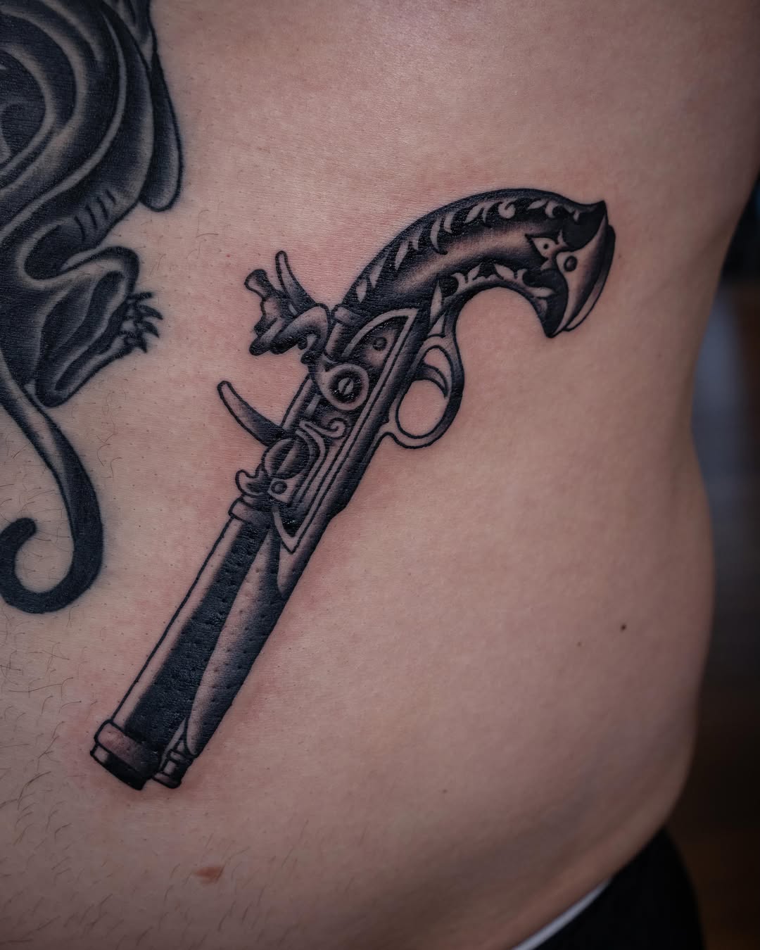 Tattoo by @justinrakowskitattoo — black_and_grey, realism