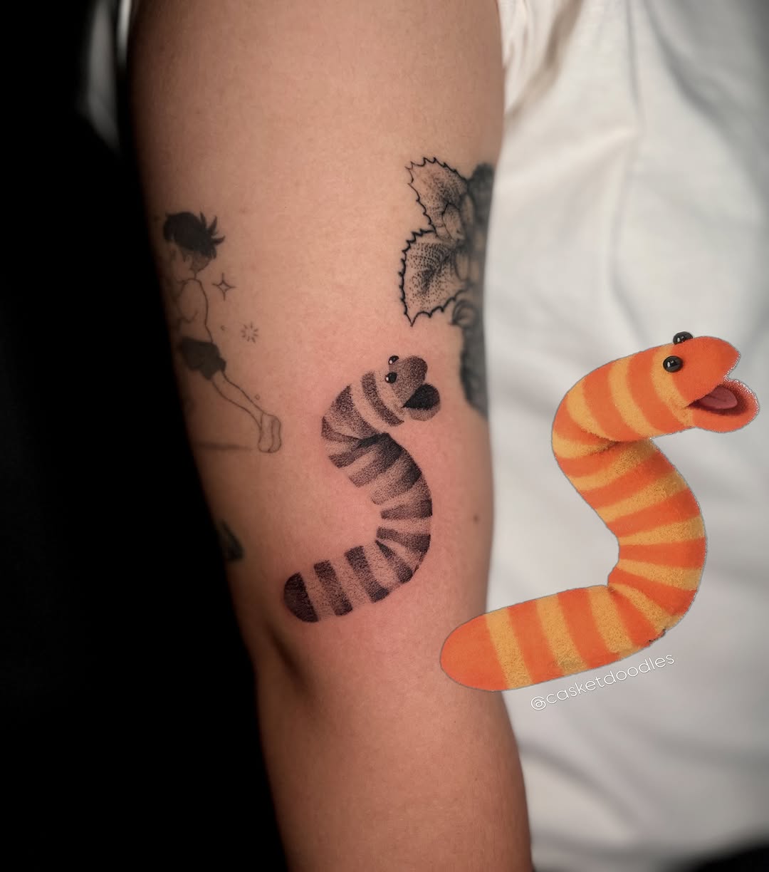 Worm ignorant tattoo on the forearm by clarissa