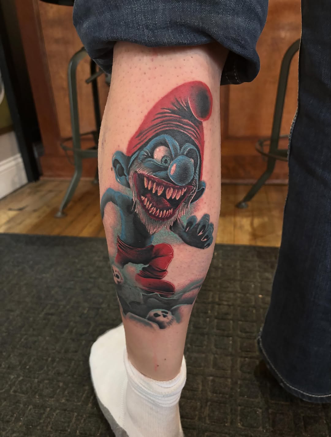 Evil smurf new school tattoo on the forearm by Aubri Aunna