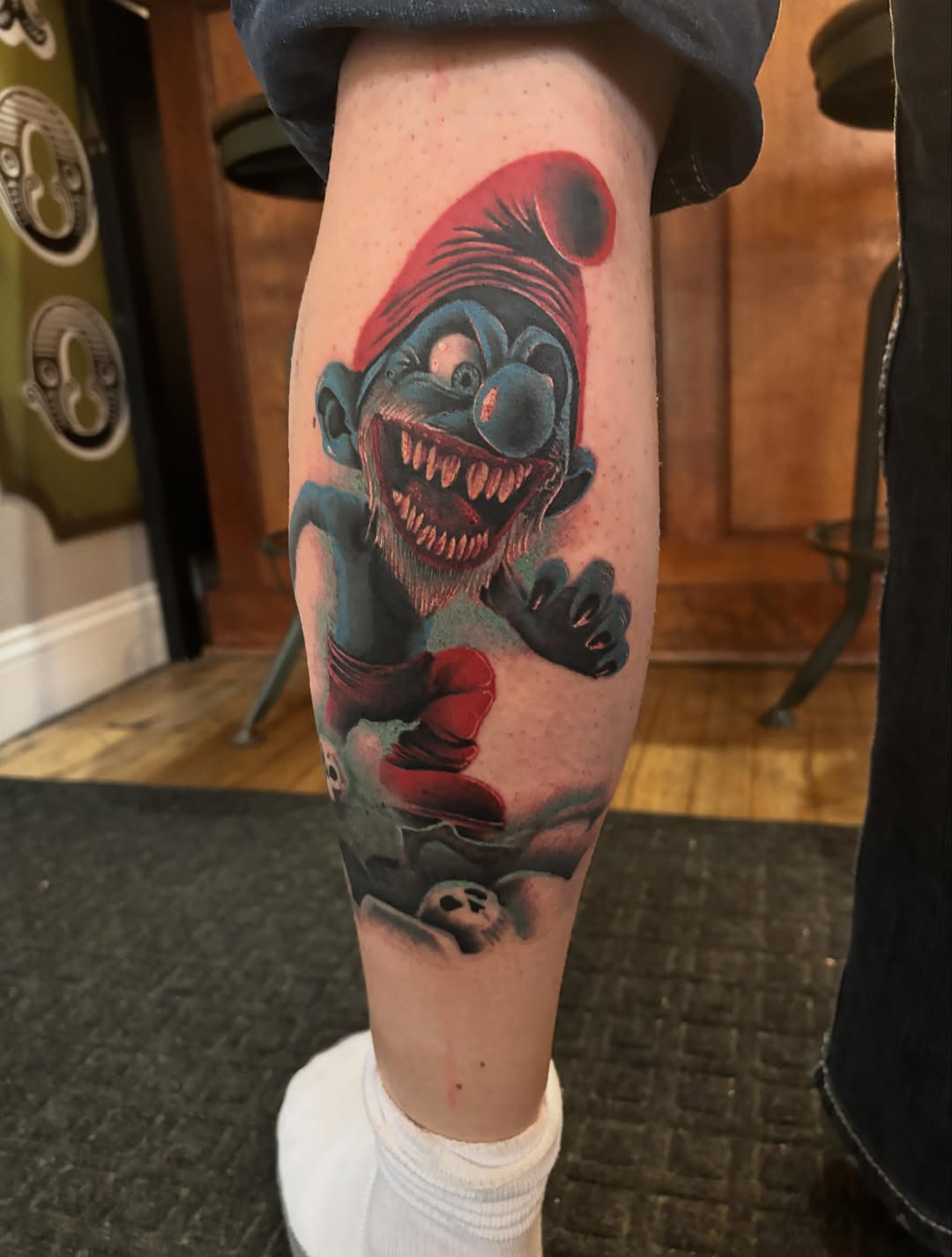 Evil smurf realism tattoo on the forearm by Aubri Aunna
