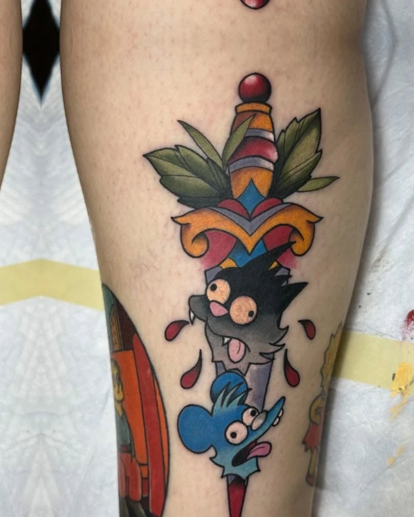 Dagger with cat and mouse characters American traditional tattoo on the leg by Greyson Heidenreich