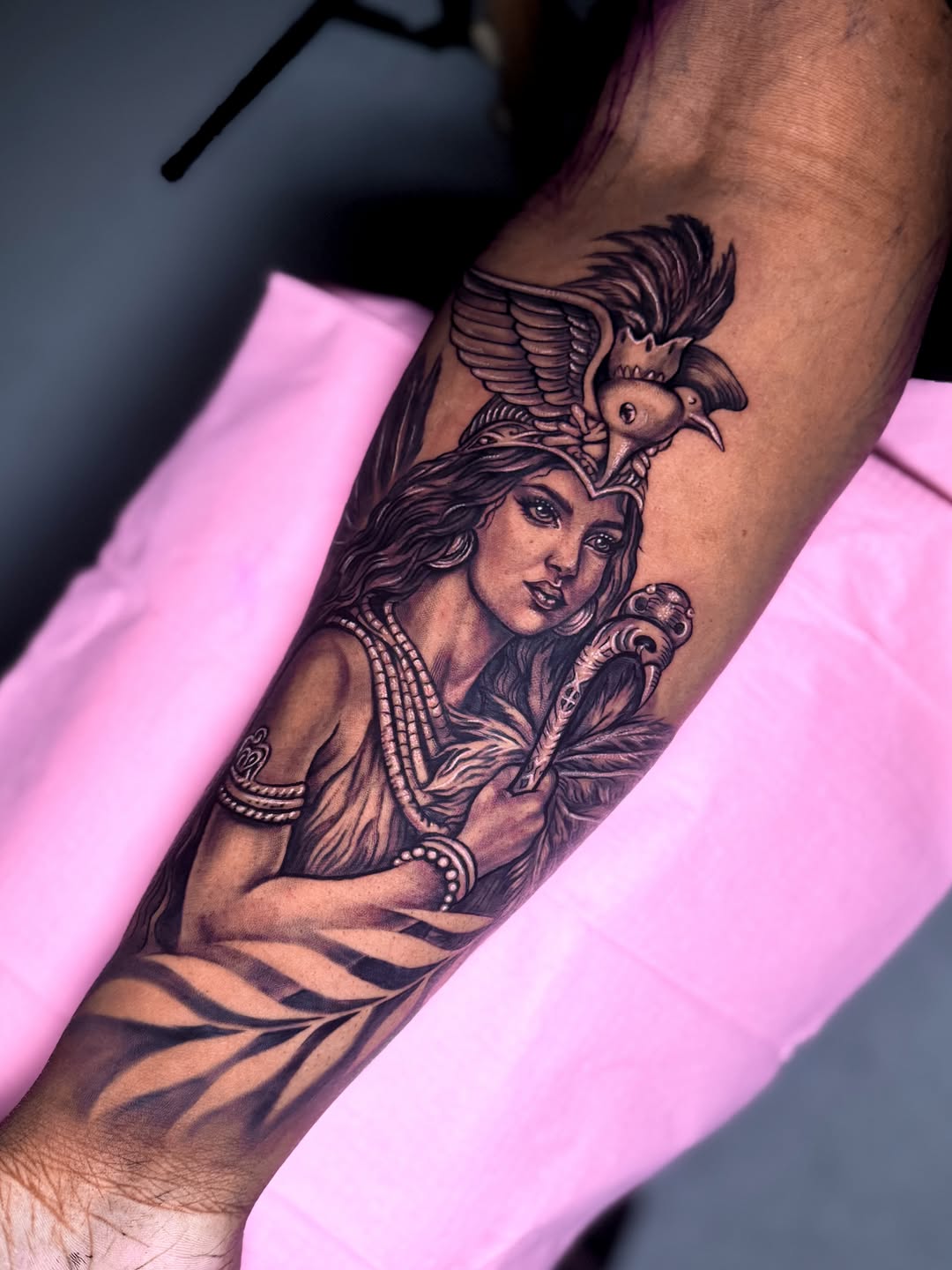 Woman with bird headdress realism tattoo on the forearm by Montreal Tattoo Artist