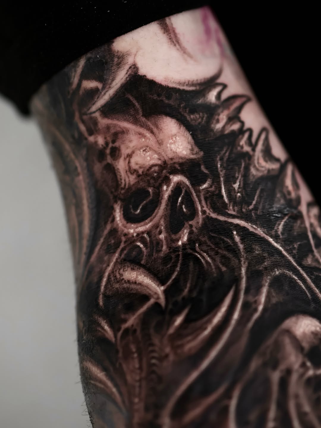 Skull and organic elements realism tattoo on the forearm by Dark tattoo