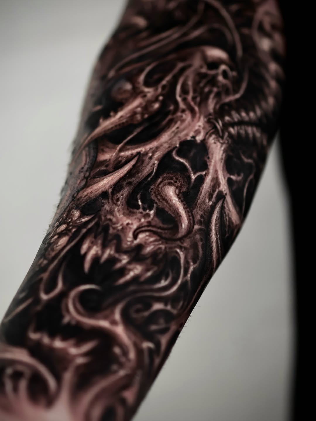 Demonic creature realism tattoo on the forearm by Dark tattoo