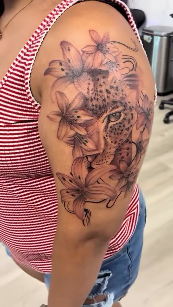 Leopard with flowers fine line tattoo on the shoulder by Tattzbyluma, Charlotte, North Carolina