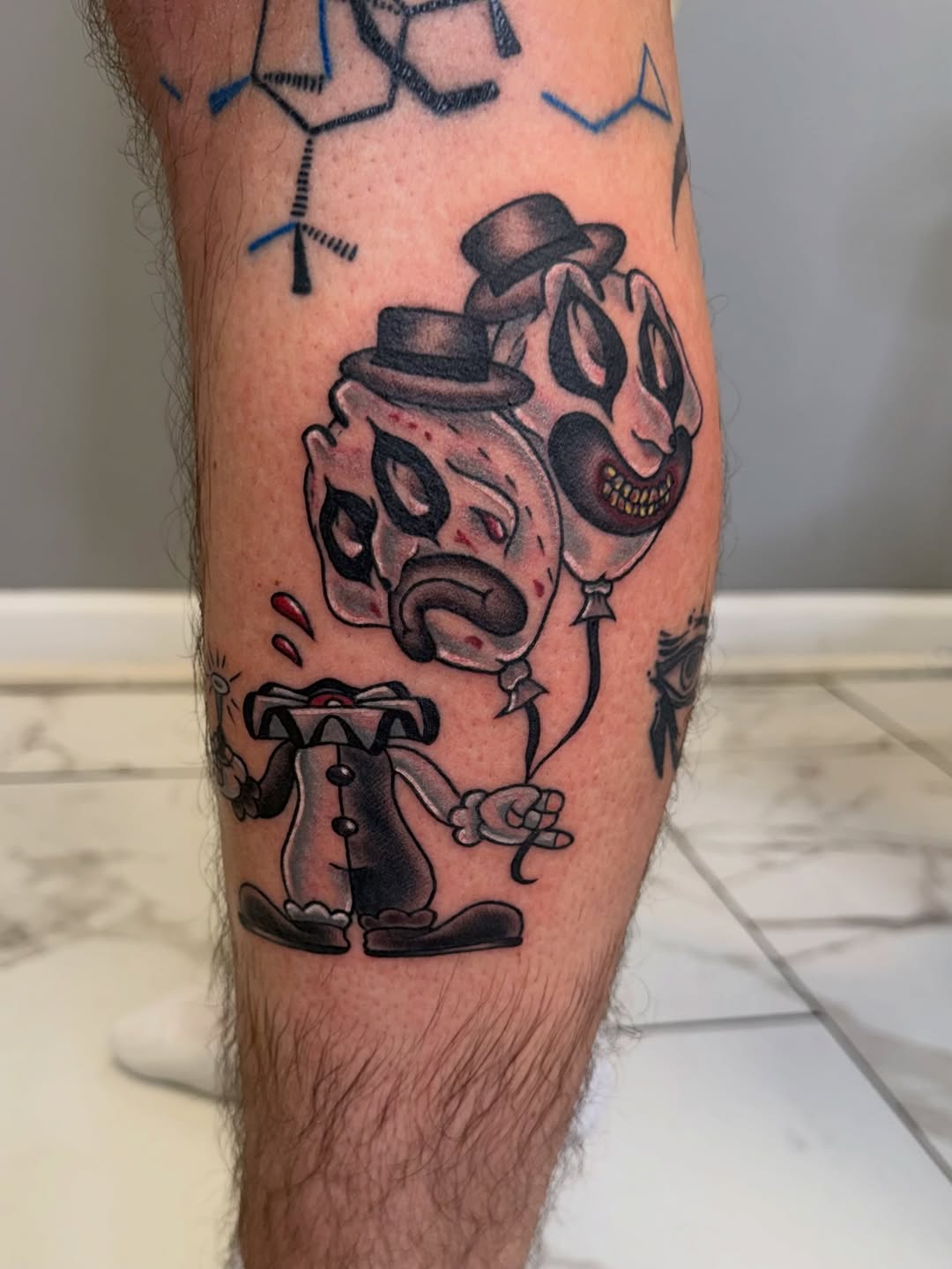 Clowns with balloons realism tattoo on the forearm by linda perez