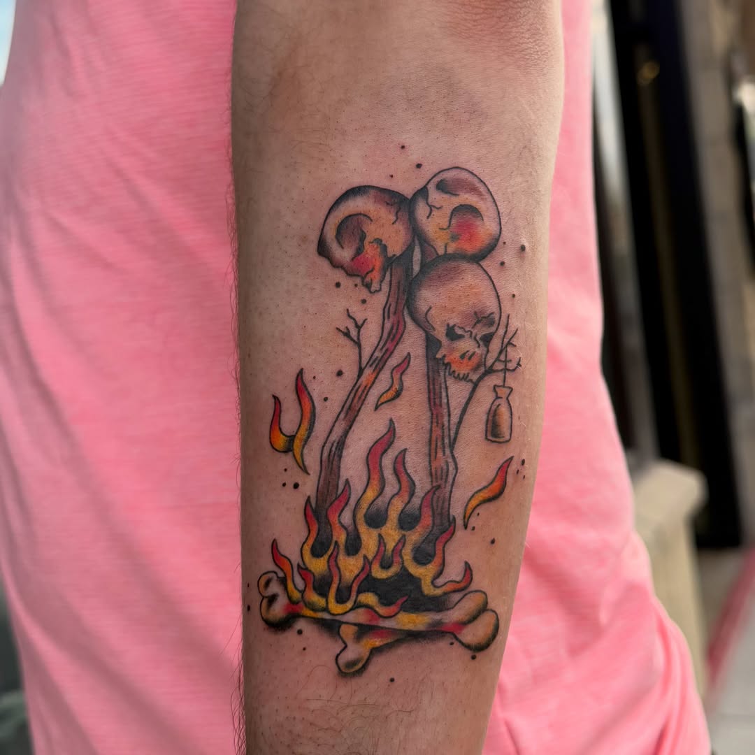 Bonfire with skull and mushrooms dotwork tattoo on the forearm by Kieara West