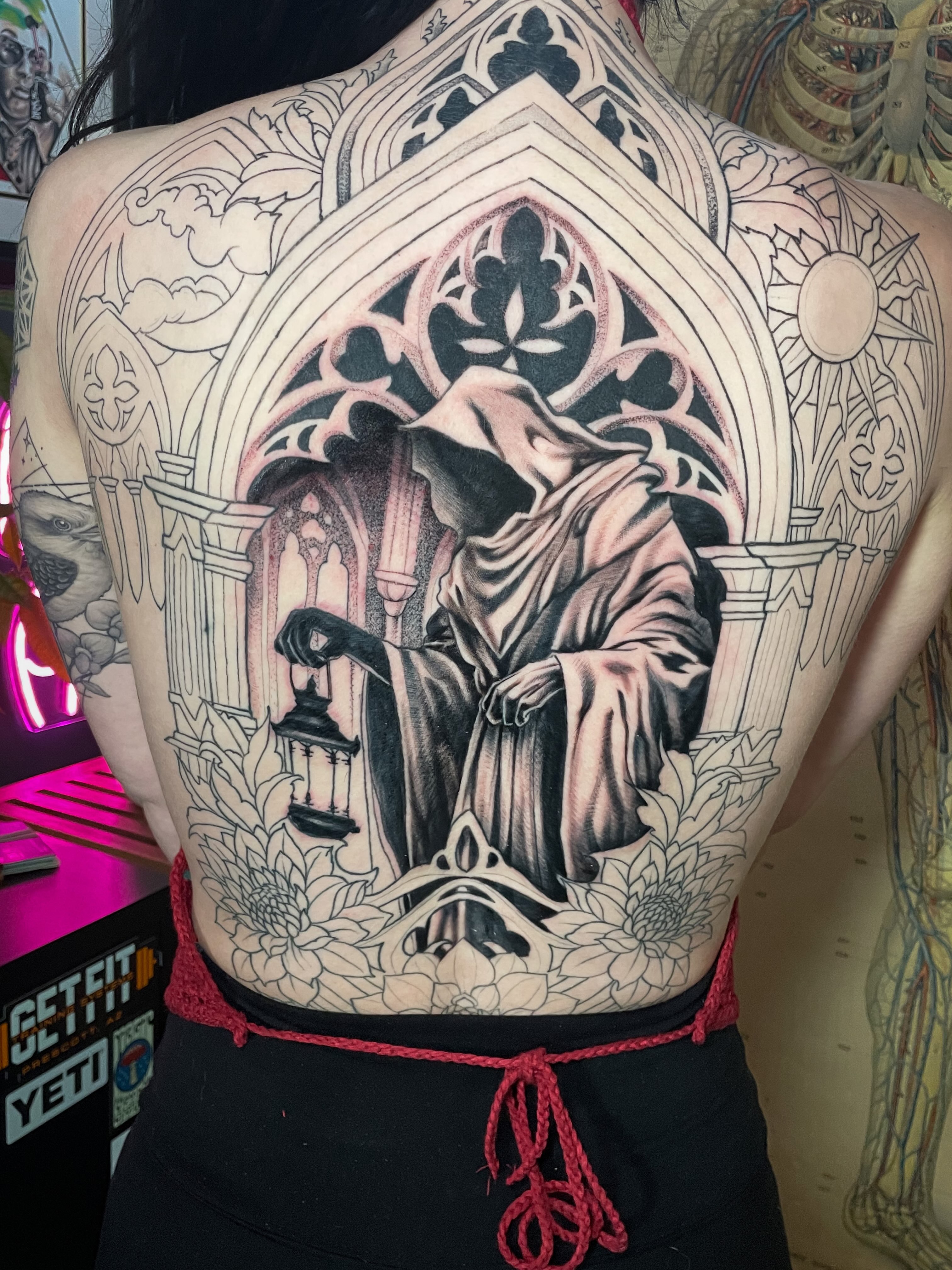 Reaper with lantern realism tattoo on the back by Dev Z