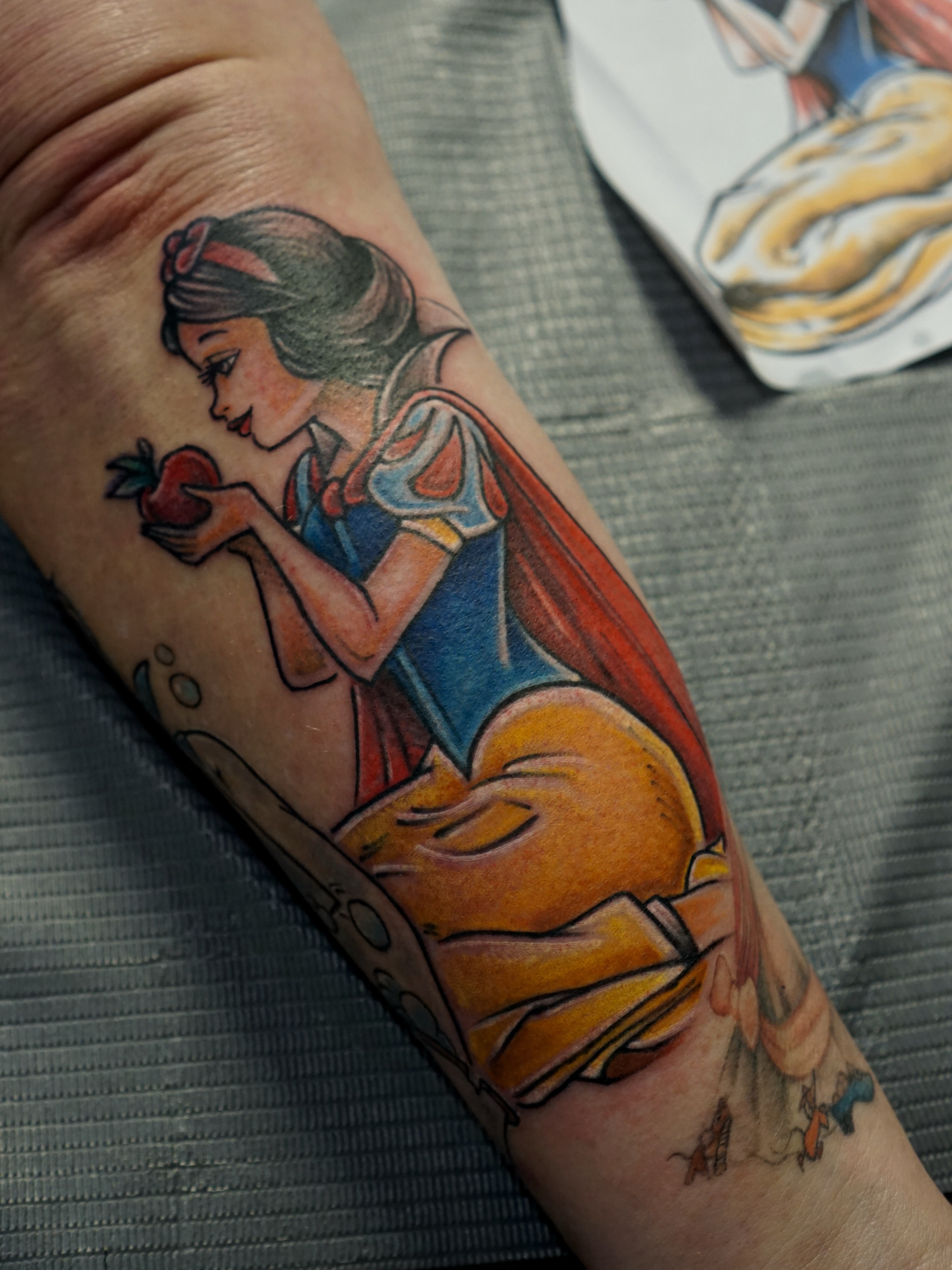 Snow White illustrative tattoo on the forearm by Nicholas Capellan, Winter Park, Florida