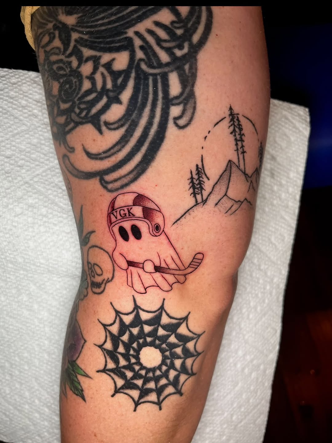 Ghost playing hockey new school tattoo on the forearm by Nick Andrade Las Vegas Tattoo Artist
