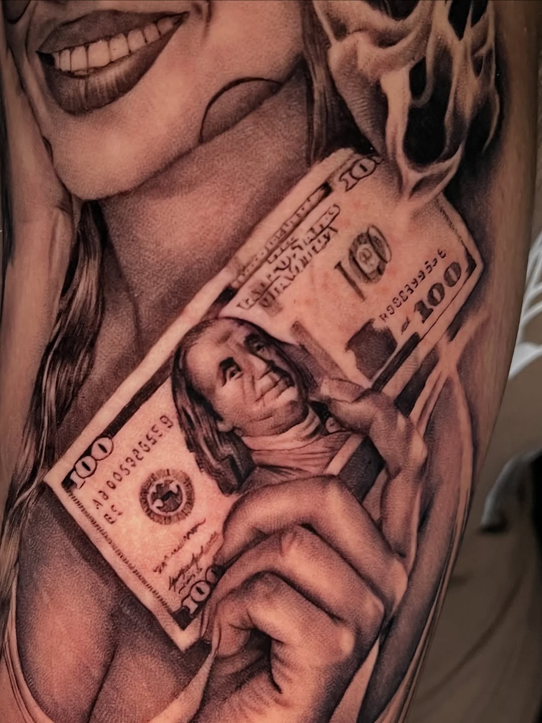 Woman holding a hundred dollar bill Chicano tattoo on the forearm by Denver Tattoo Artist