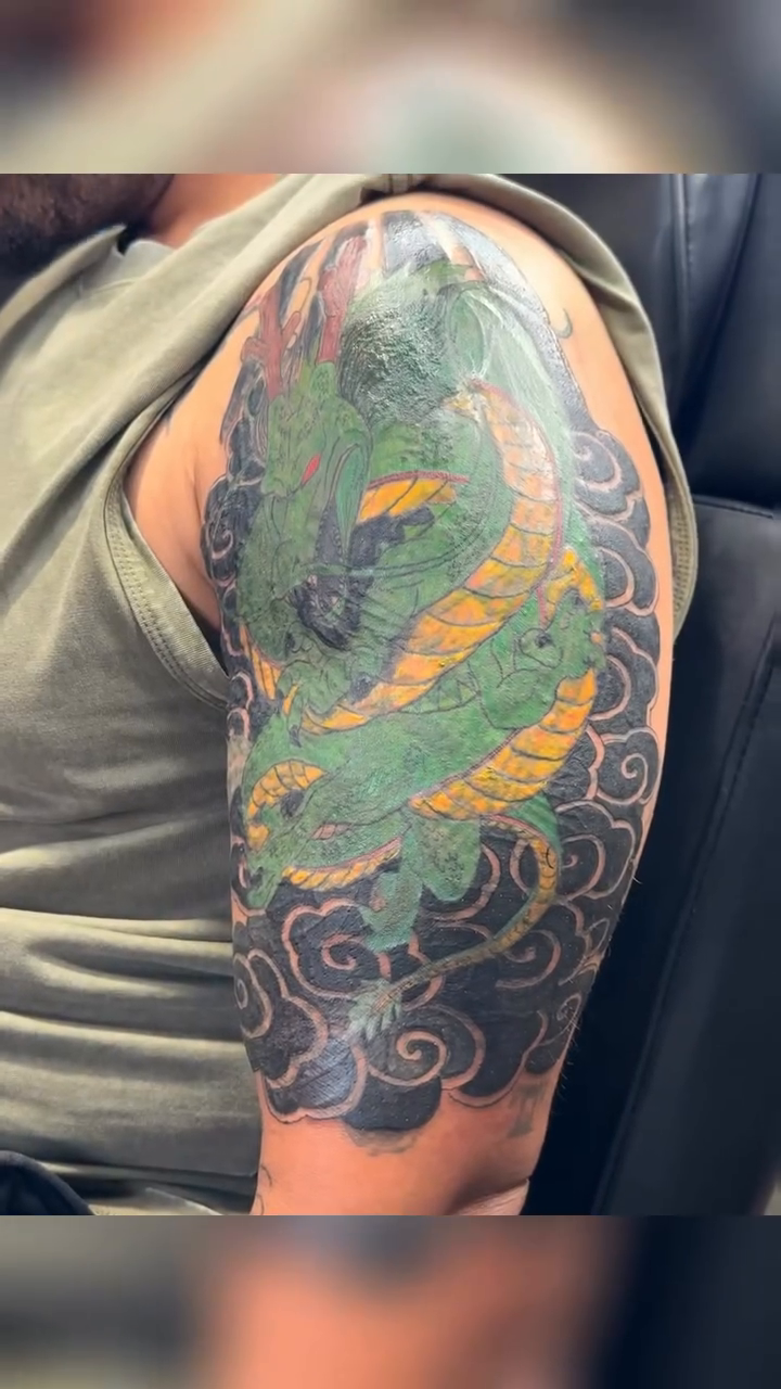 Dragon tattoo on arm Japanese tattoo on the head by Jones Eric