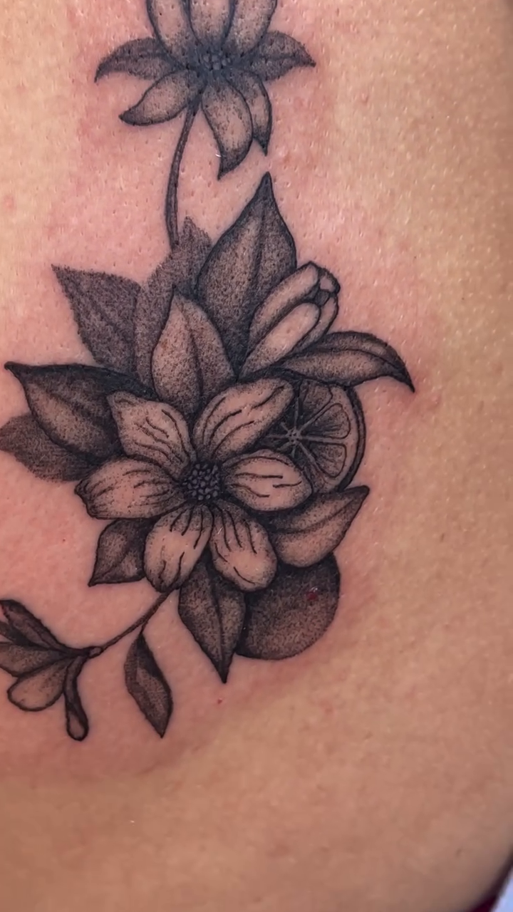 Floral arrangement tattoo dotwork tattoo on the shoulder by Amy