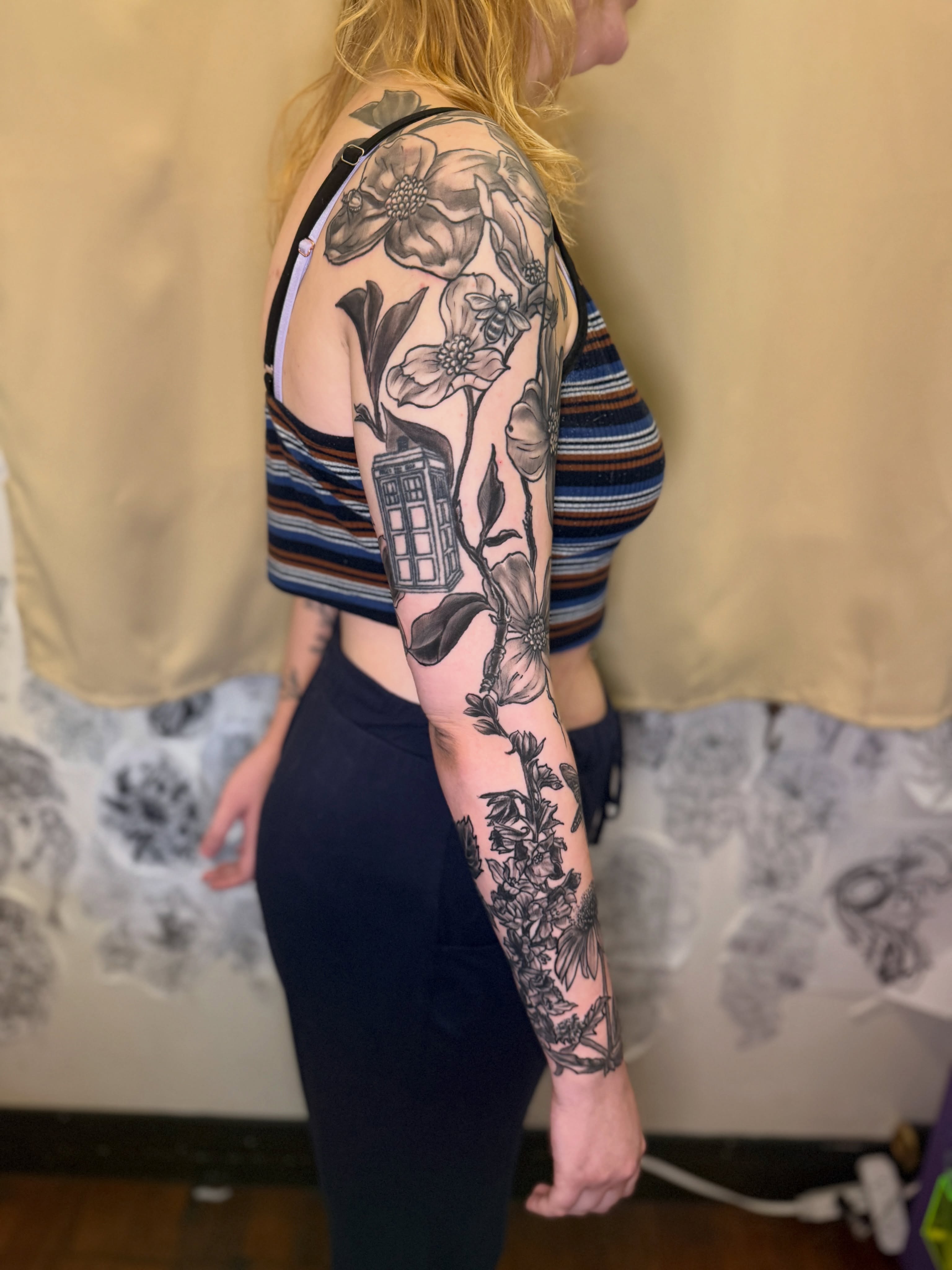 Flowers and tardis realism tattoo on the forearm by ❈°binx°❈