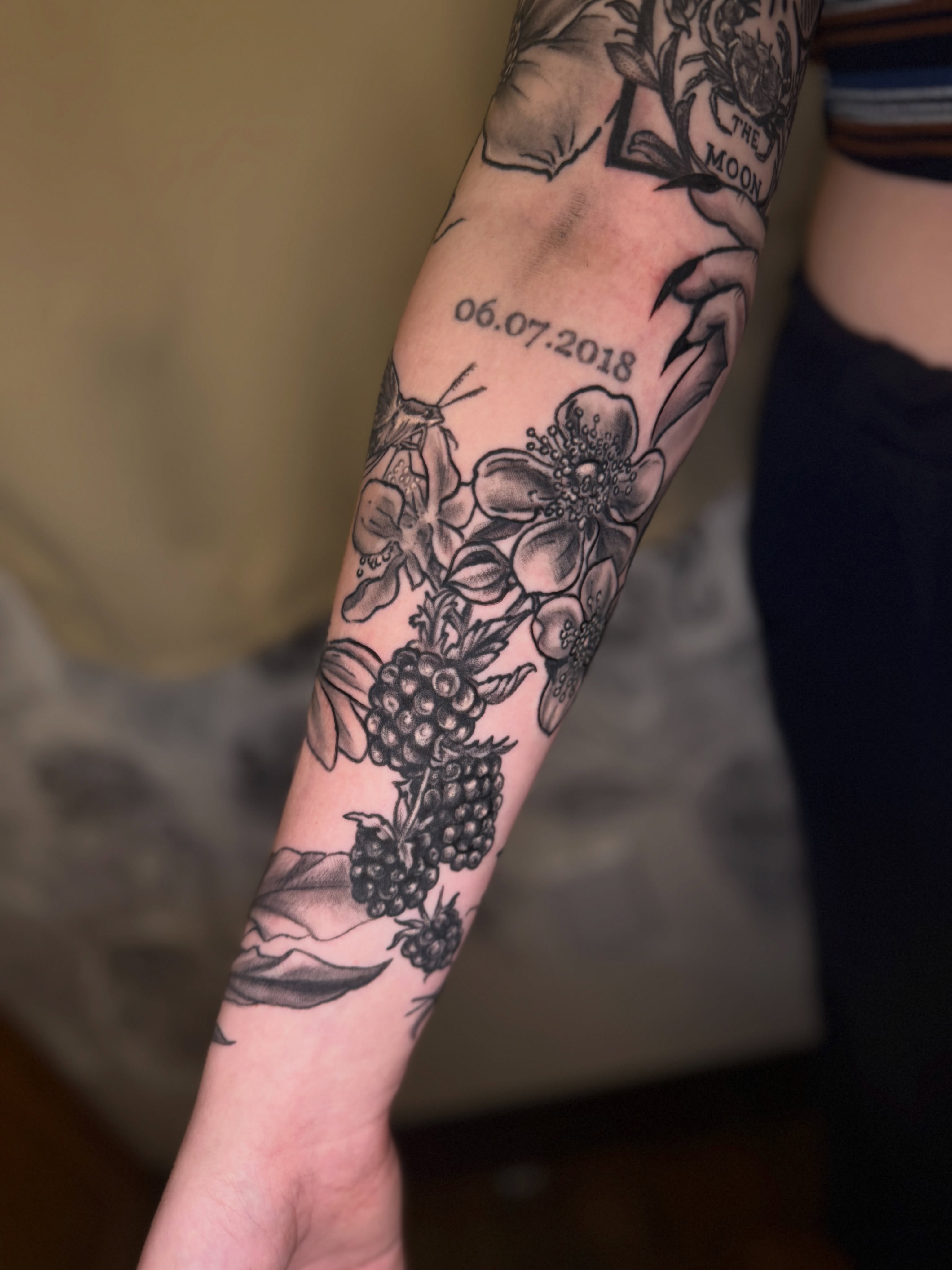 Berries and flowers black and grey tattoo on the forearm by ❈°binx°❈