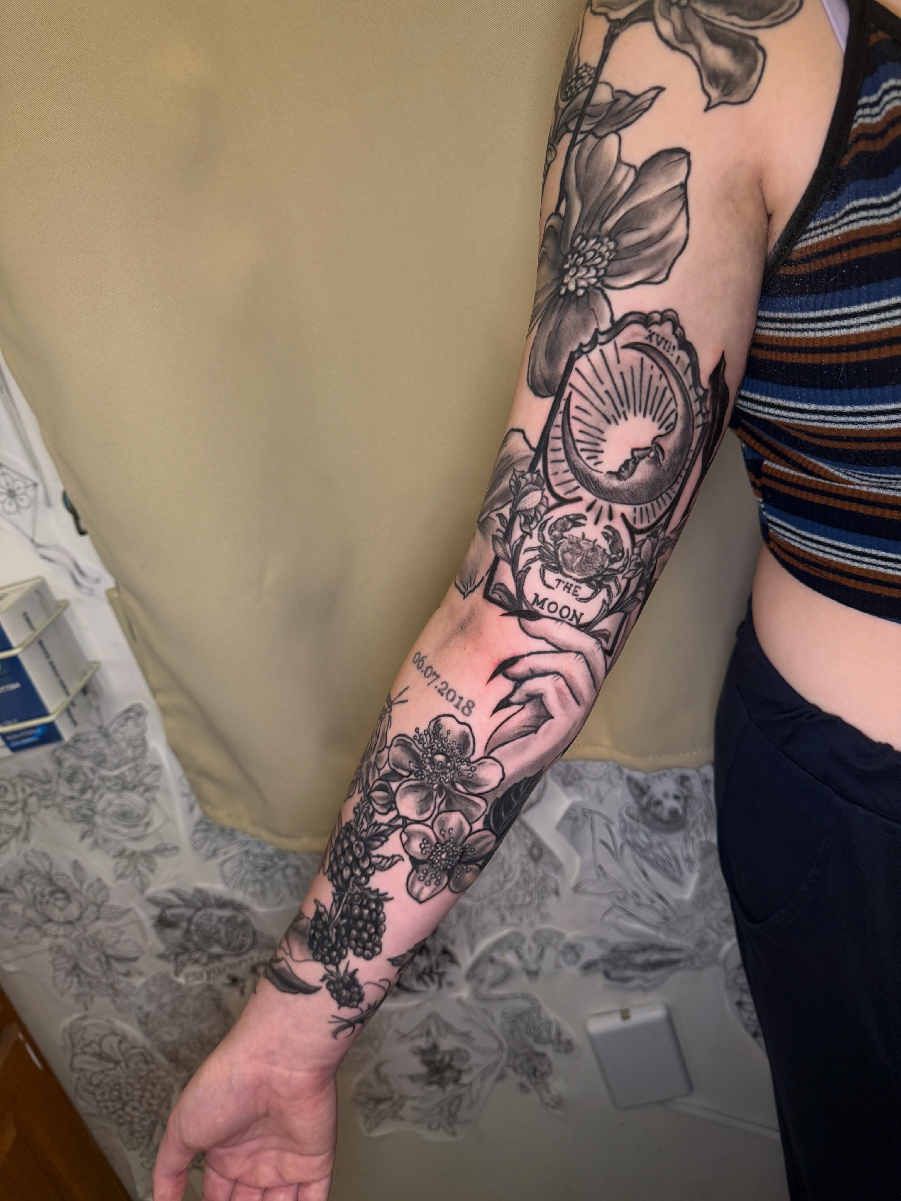 Moon phases and flowers black and grey tattoo on the forearm by ❈°binx°❈
