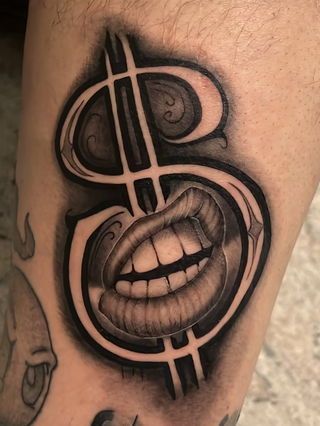 Dollar sign with mouth realism tattoo on the forearm by Dallas tx tattoo artist ✝️