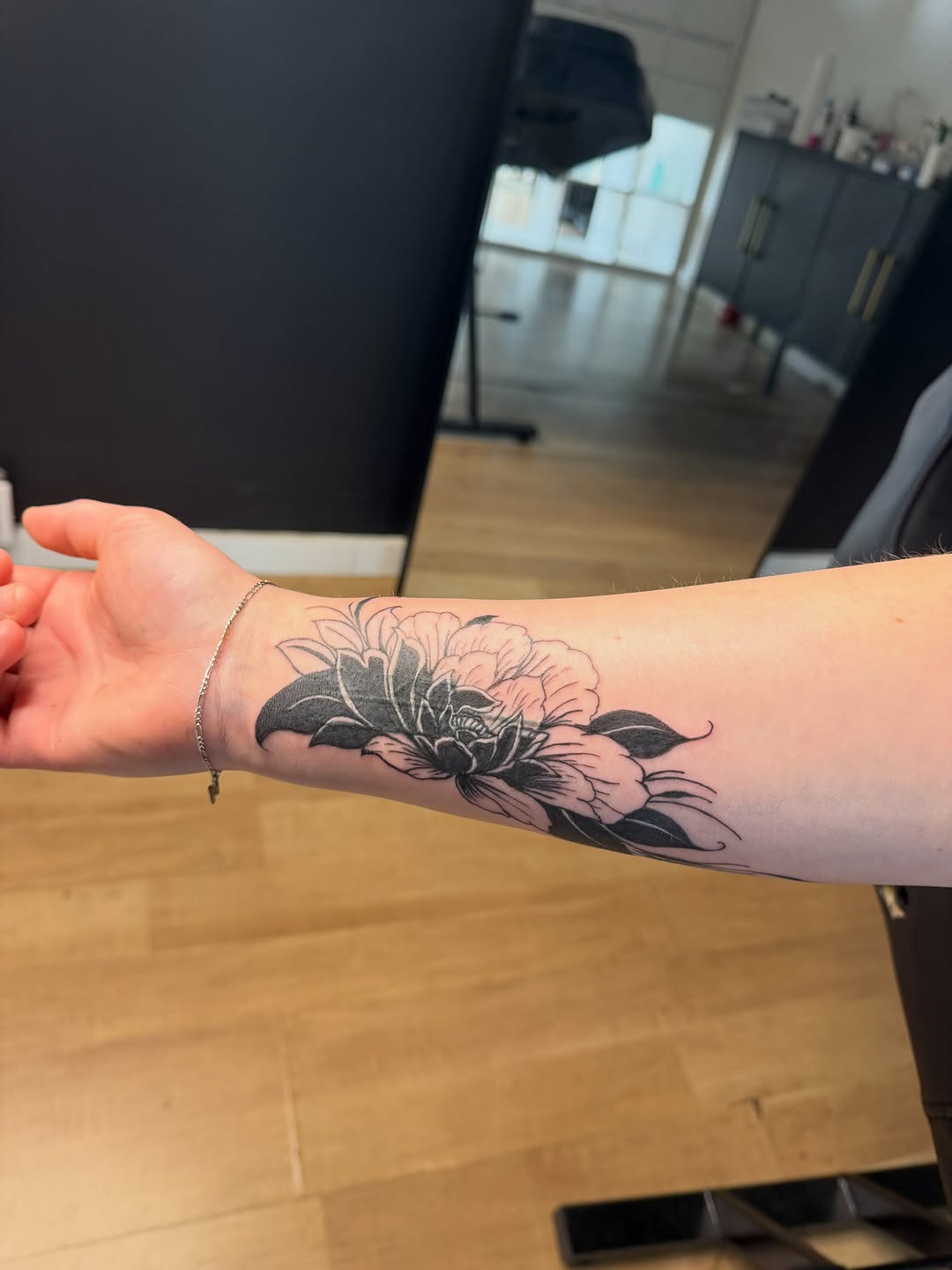 Peony flower fine line tattoo on the forearm by TolzinInk, Brookings, South Dakota