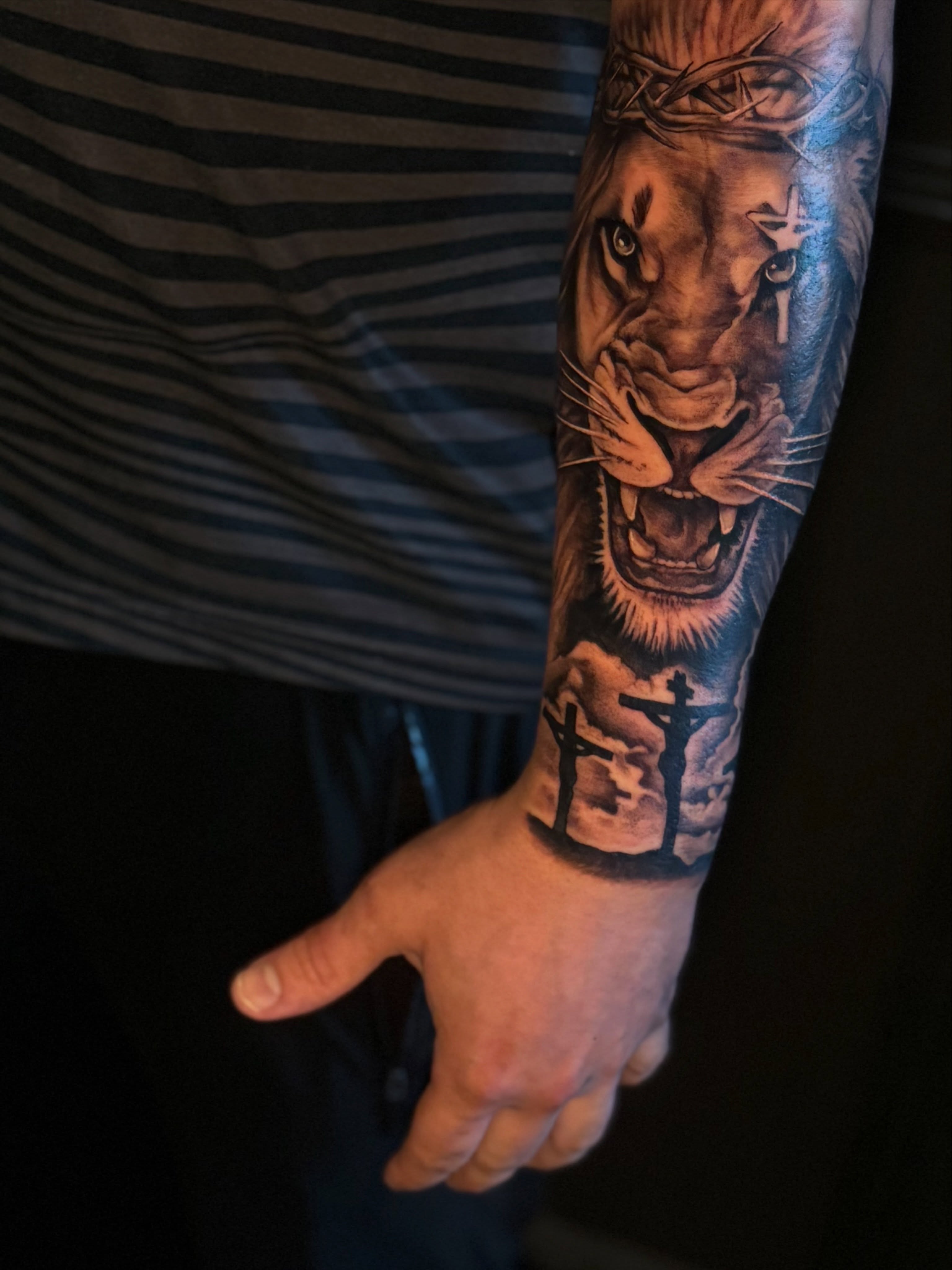 Lion realism tattoo on the forearm by Lily Nurnberger