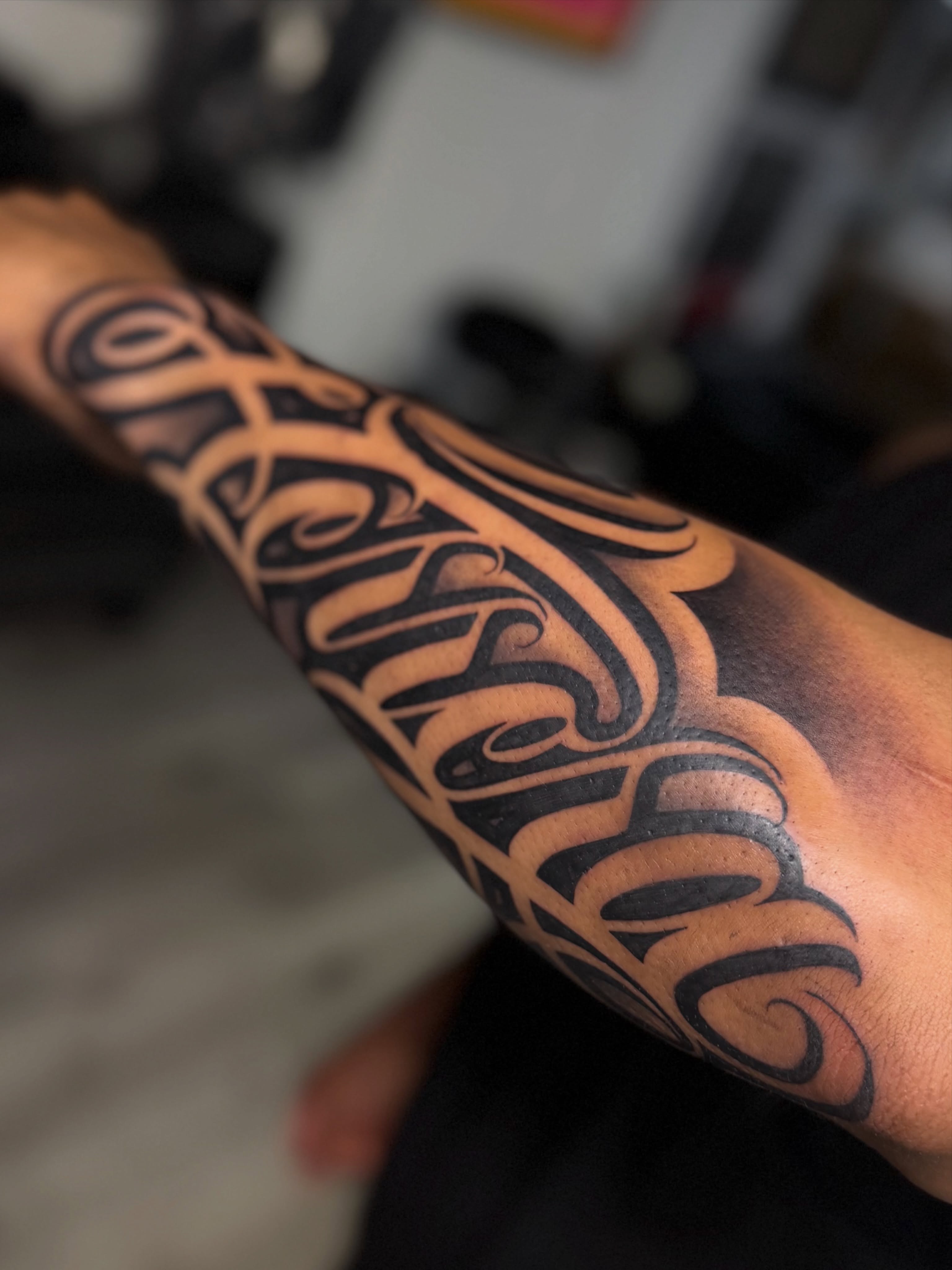 Script lettering lettering script tattoo on the forearm by Rocky G Inkz LLC