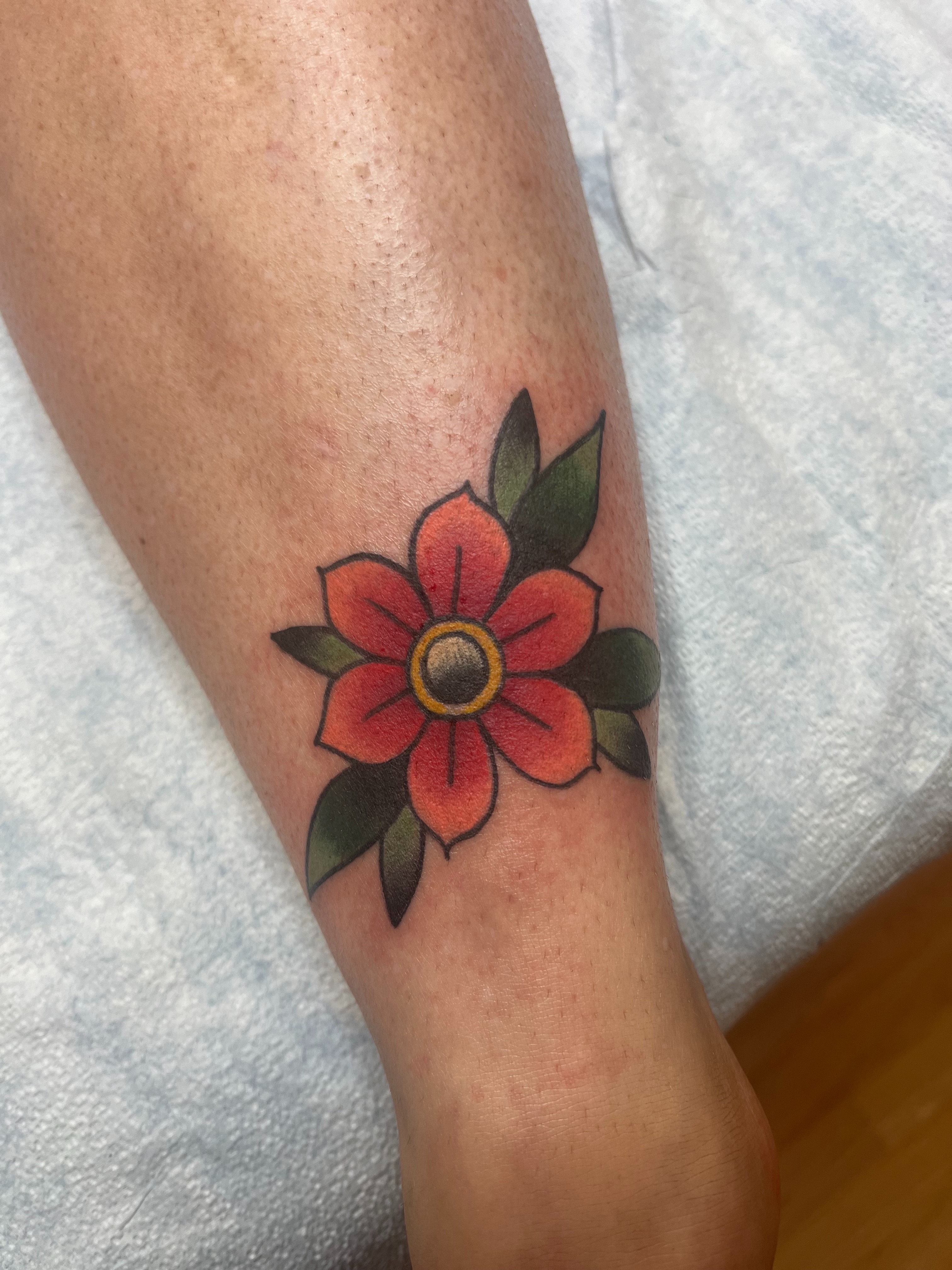 Flower American traditional tattoo on the forearm by Fizzy Jizzles, Worcester, England