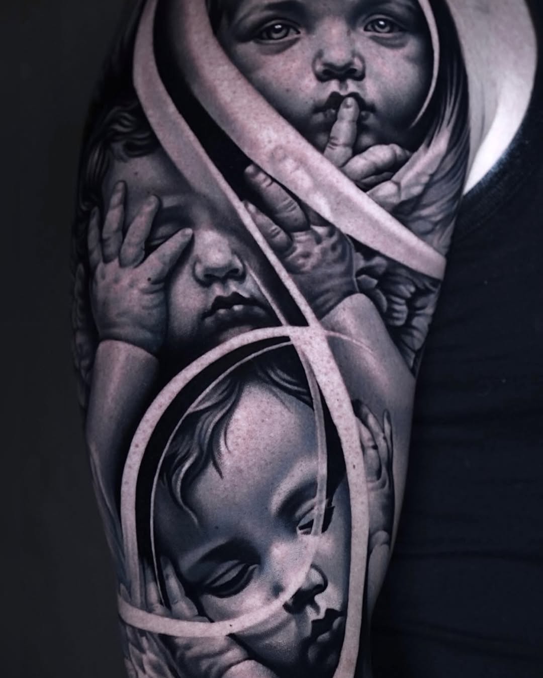 Cherubs realism tattoo on the forearm by Sadier Alfonso