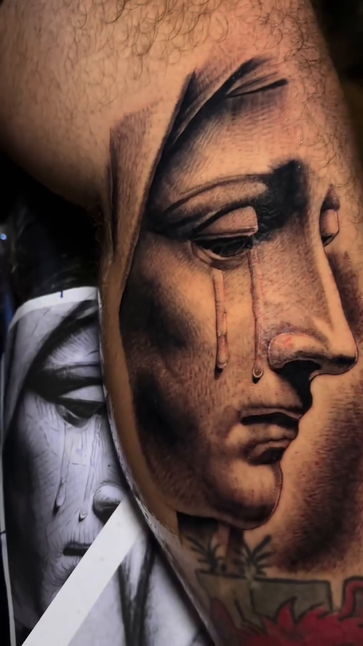 Weeping Virgin Mary portrait Chicano tattoo on the upper arm by Fullerton ca tattooing