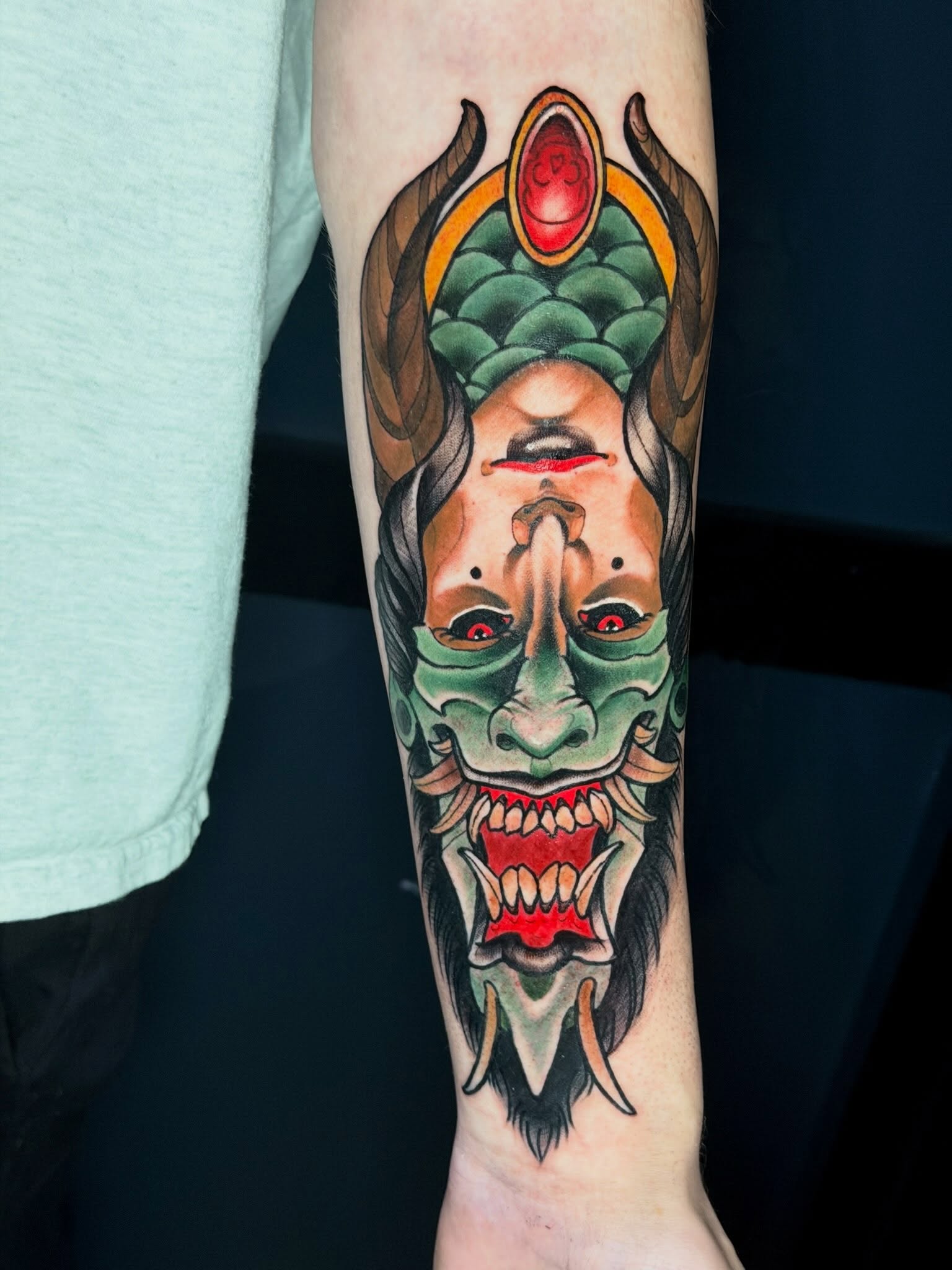 Demon mask American traditional tattoo on the forearm by 𝐀𝐧𝐝𝐲 𝐁𝐚𝐠𝐥𝐞𝐲