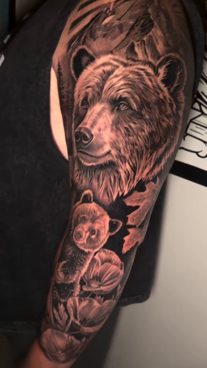 Realism tattoo on the upper arm by DH Tattooing
