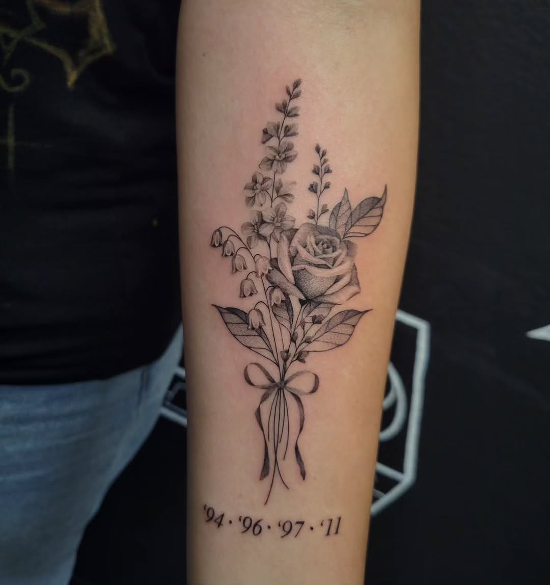 Bouquet of flowers with dates fine line tattoo on the forearm by Marina Cobb